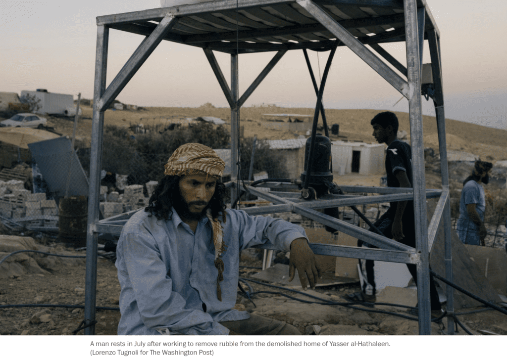 Washington Post — Young men in a Palestinian village rest while removing rubble of a demolished brick house in Palestine